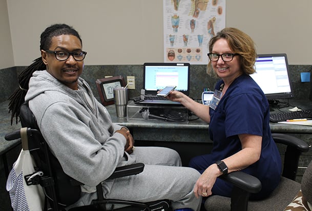 Speech therapist doing voice exercises with female patient