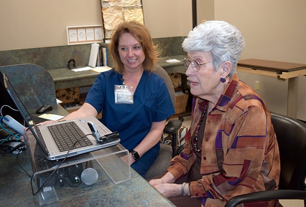 Therapist and older patient working on voice therapy