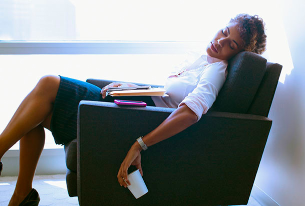 woman sleeping in an armchair