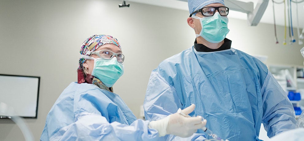Surgeons in PPE in operating room