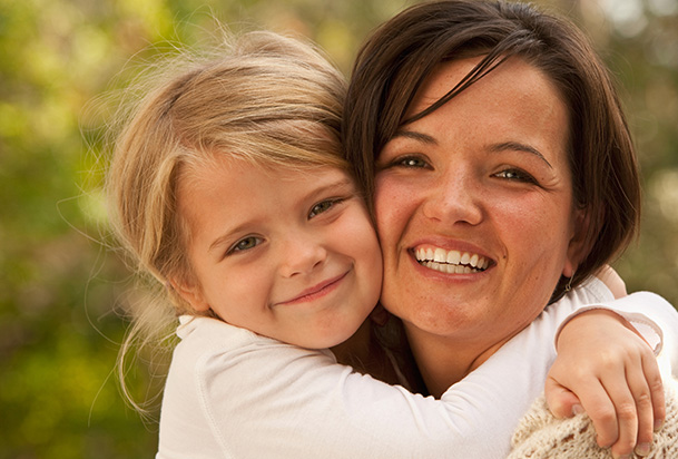 woman and girl hugging