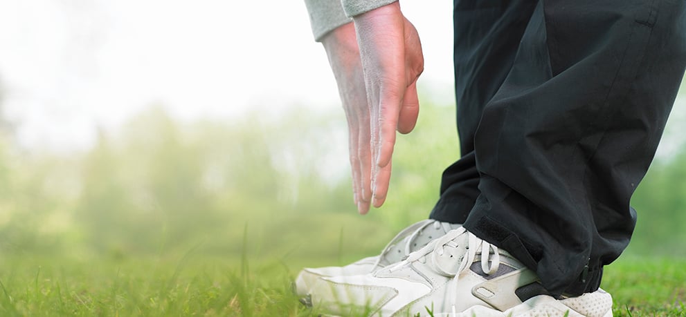 Person reaching toward his toes