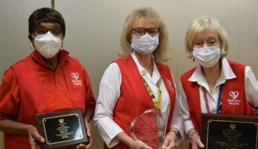 Cheryl Storey Mended Hearts Award 3 women showing off awards
