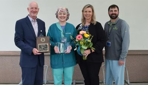 Remmers accepts award