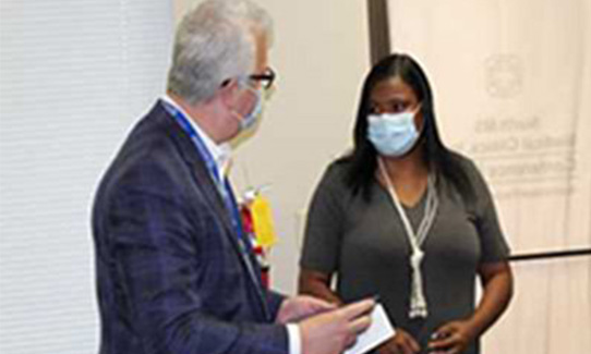 Presenting Strong with the bee award