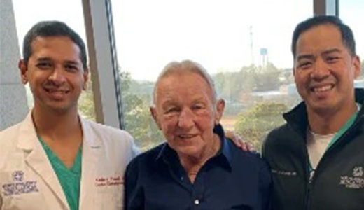 Dr. Karthik Prasad (left) and Dr. Richard Arriola (right) recently performed the state’s first transhepatic Watchman procedure on Gary Cameron of Ecru. 