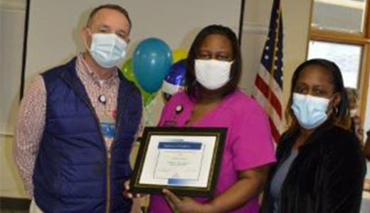 Barry Keel (from left), NMMC-West Point administrator, and Veronica Sawyer, Environmental Services supervisor, congratulate Felicia Rice on being named as the hospital’s Employee of the Quarter.
