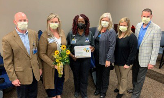 presenting beatrice smith with the bee award