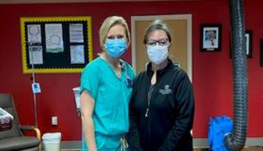 Registered nurses Ashley Pollard and Brenda Pennington administer monoclonal antibodies to COVID-19 positive patients who are at high risk of getting severely ill.