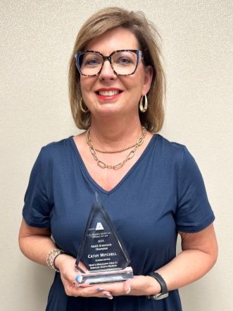 Cathy Mitchell Award holds 2025 Alabama Hospital Association Grassroots Champion Award.