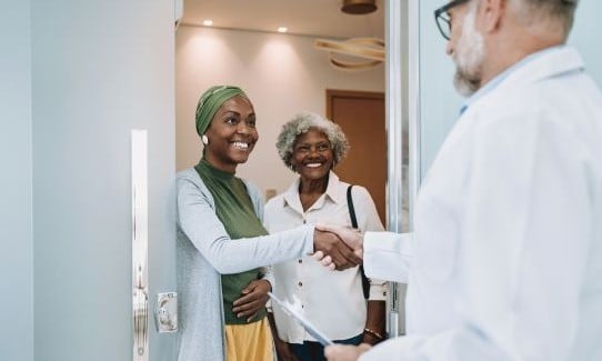 Adult woman and mom arrive to discuss oncology genetic counseling.