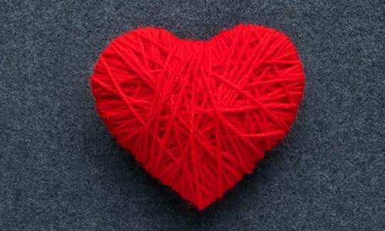 Red heart made of yarn