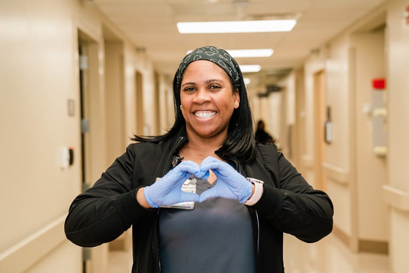 RN posing with Heart Hands