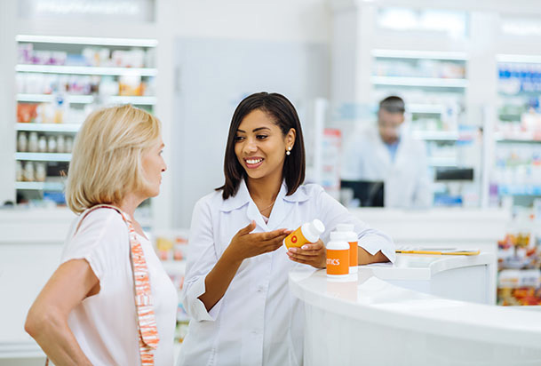 woman talking to a pharmacist