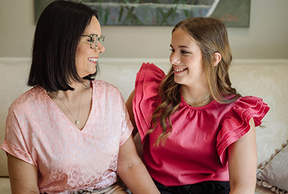 Woman and daughter smiling