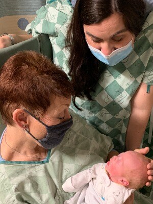 Grandmother meets new grandson for the first time in NICU