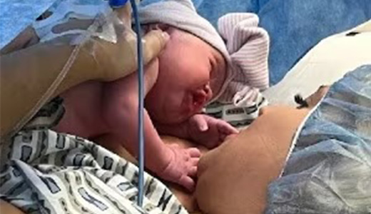 mother holding new born baby