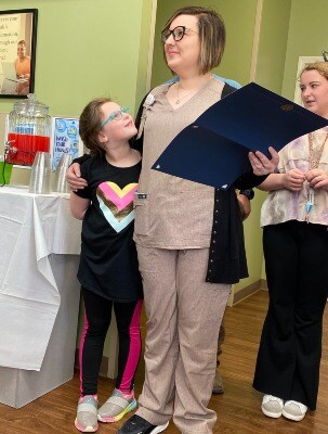 Alaina Collins receives award