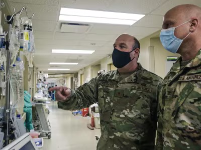 Two DOD officers tour COVID critical care unit