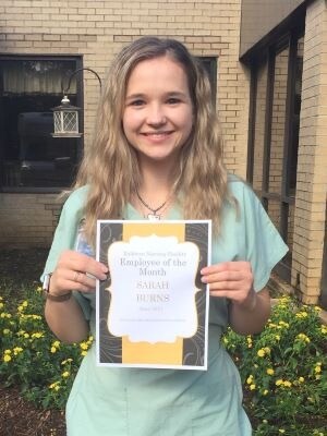 Sarah Burnes accepts award