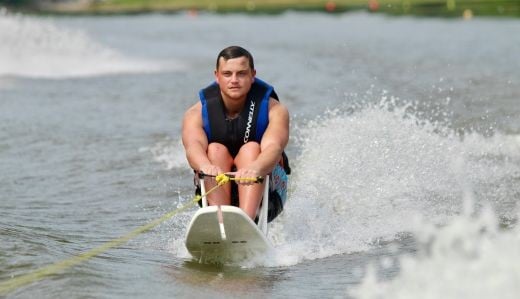 skier on adaptive water ski equipment on lake