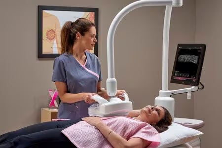 Technologist uses ABUS to scan patient's breast