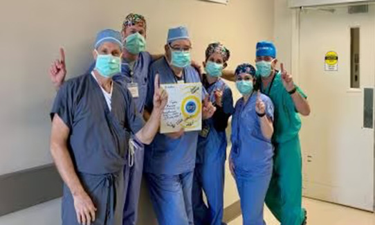 group of doctors with masks and hair nets