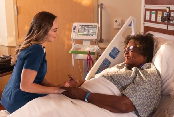 Nurse at patient bedwise