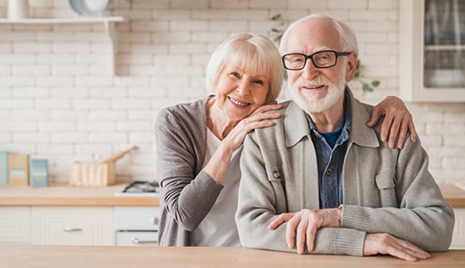 Smiling elderly woman and man