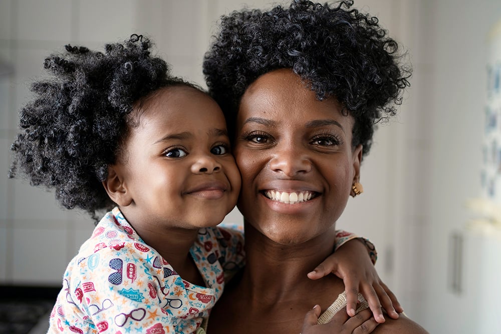 Smiling mother and daughter