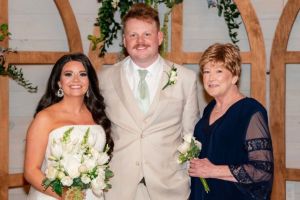 The team at Breast and General Surgery made sure breast cancer survivor Cathy Taylor felt confident at her son's wedding. Photo shows bride and groom with Cathy Taylor.