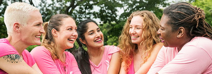Group of women in pink shirts