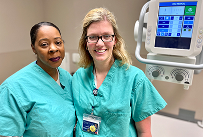 Nurses in front of an x-ray machine