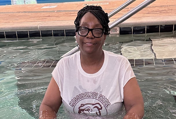 Woman doing aquatic therapy in a swimming pool