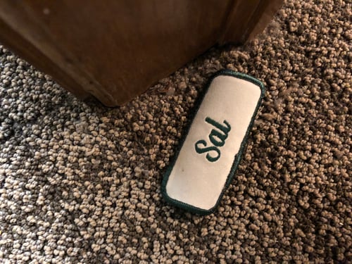 The name Sal on a nametag