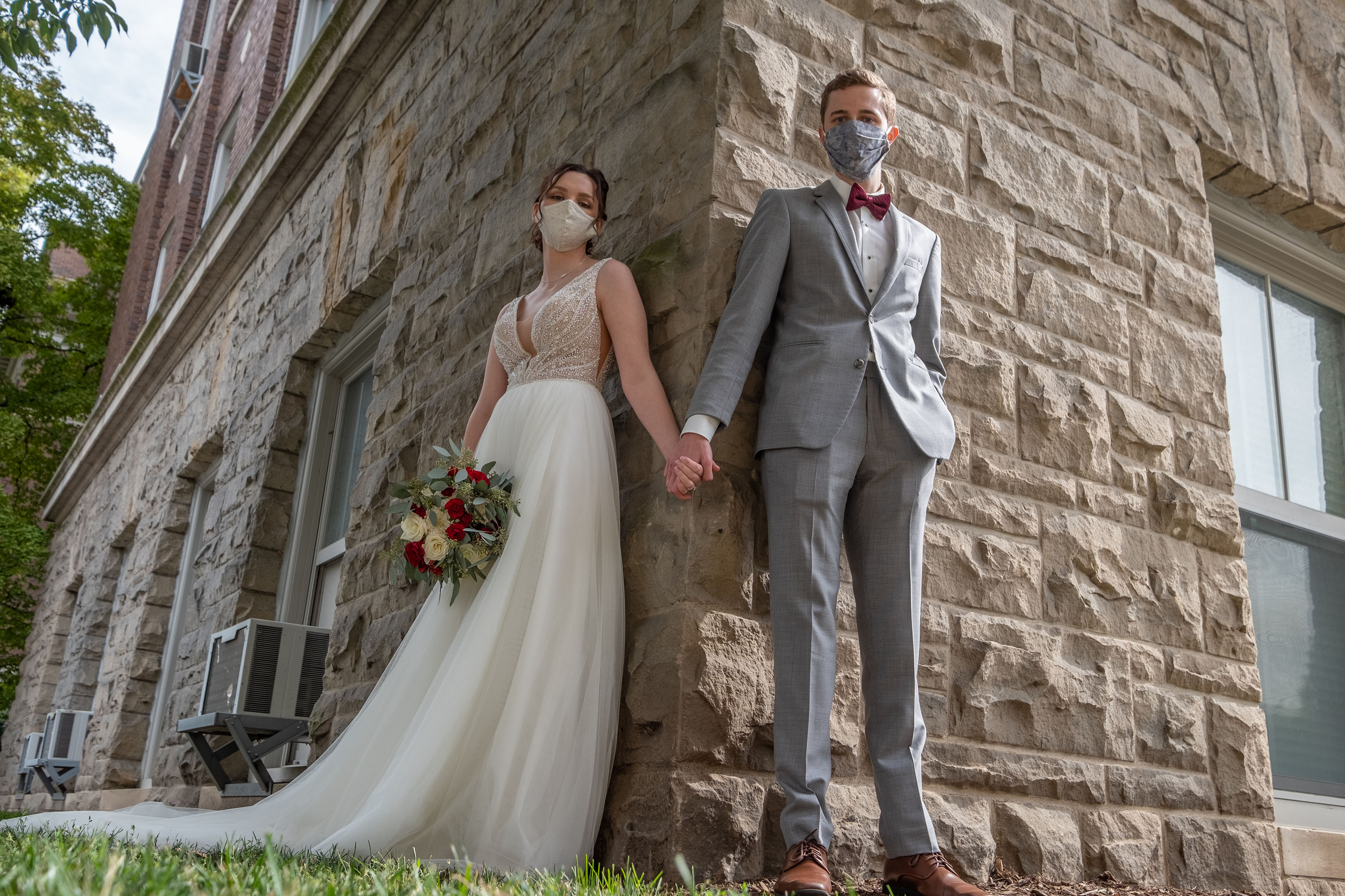 Wedding couple wearing masks