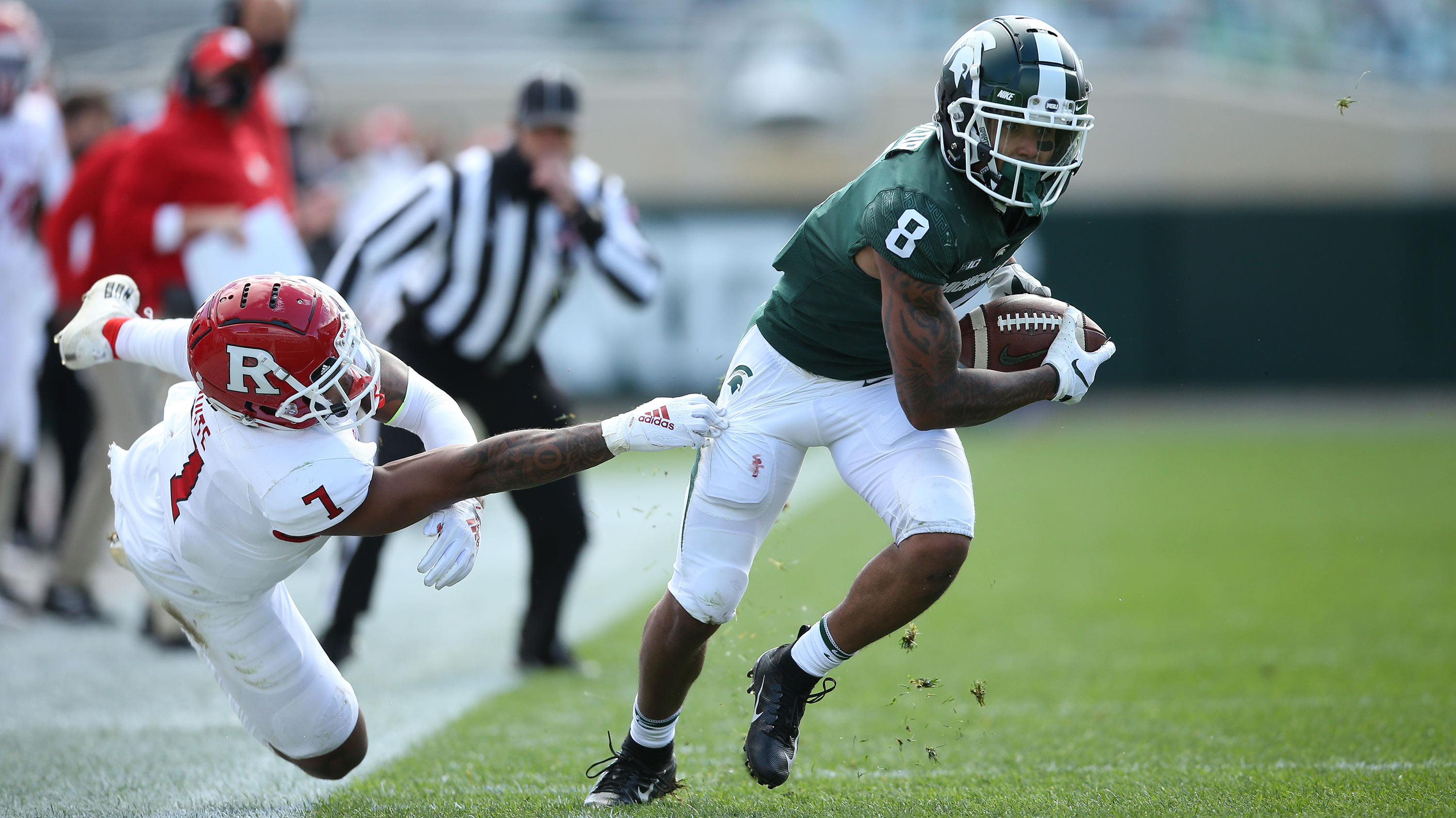 football player running with ball
