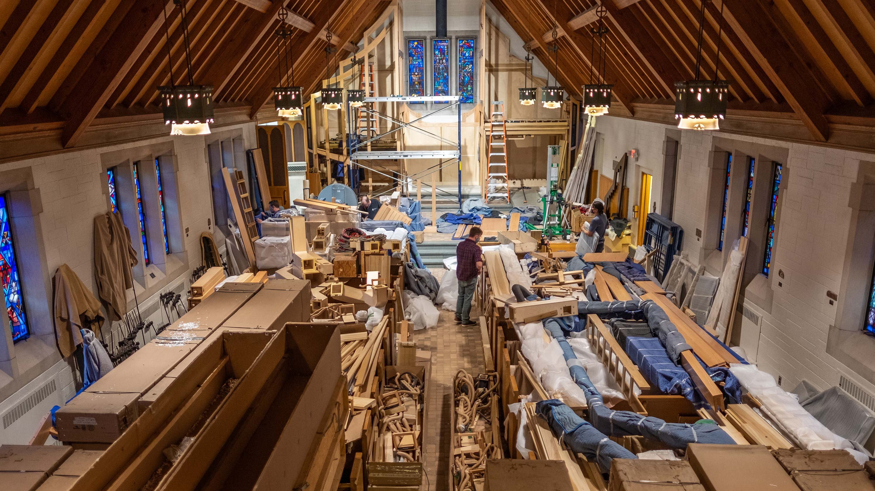 Workers installing a pipe organ