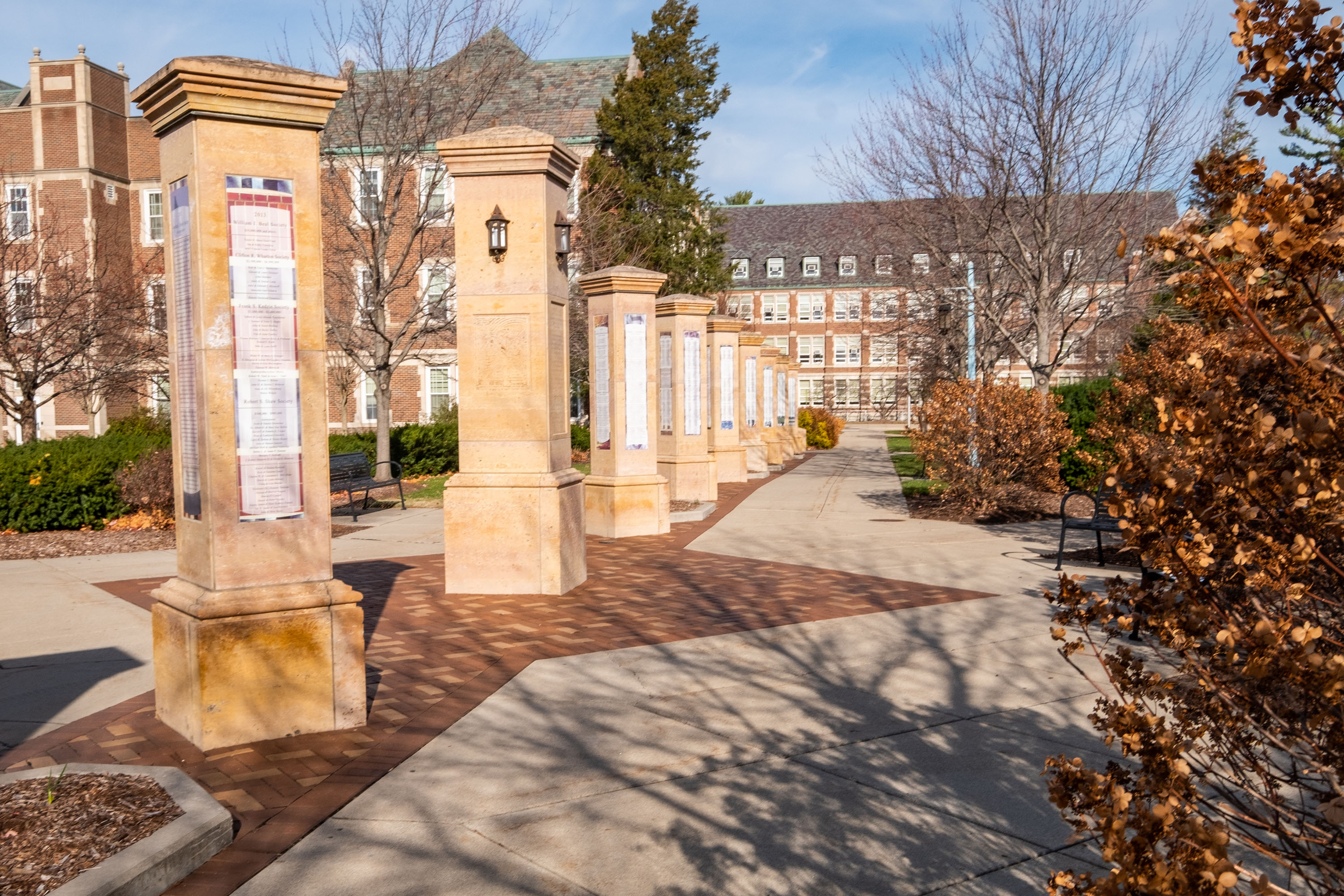 Columns in Benefactor's Plaza with Berkey Hall in the background. 