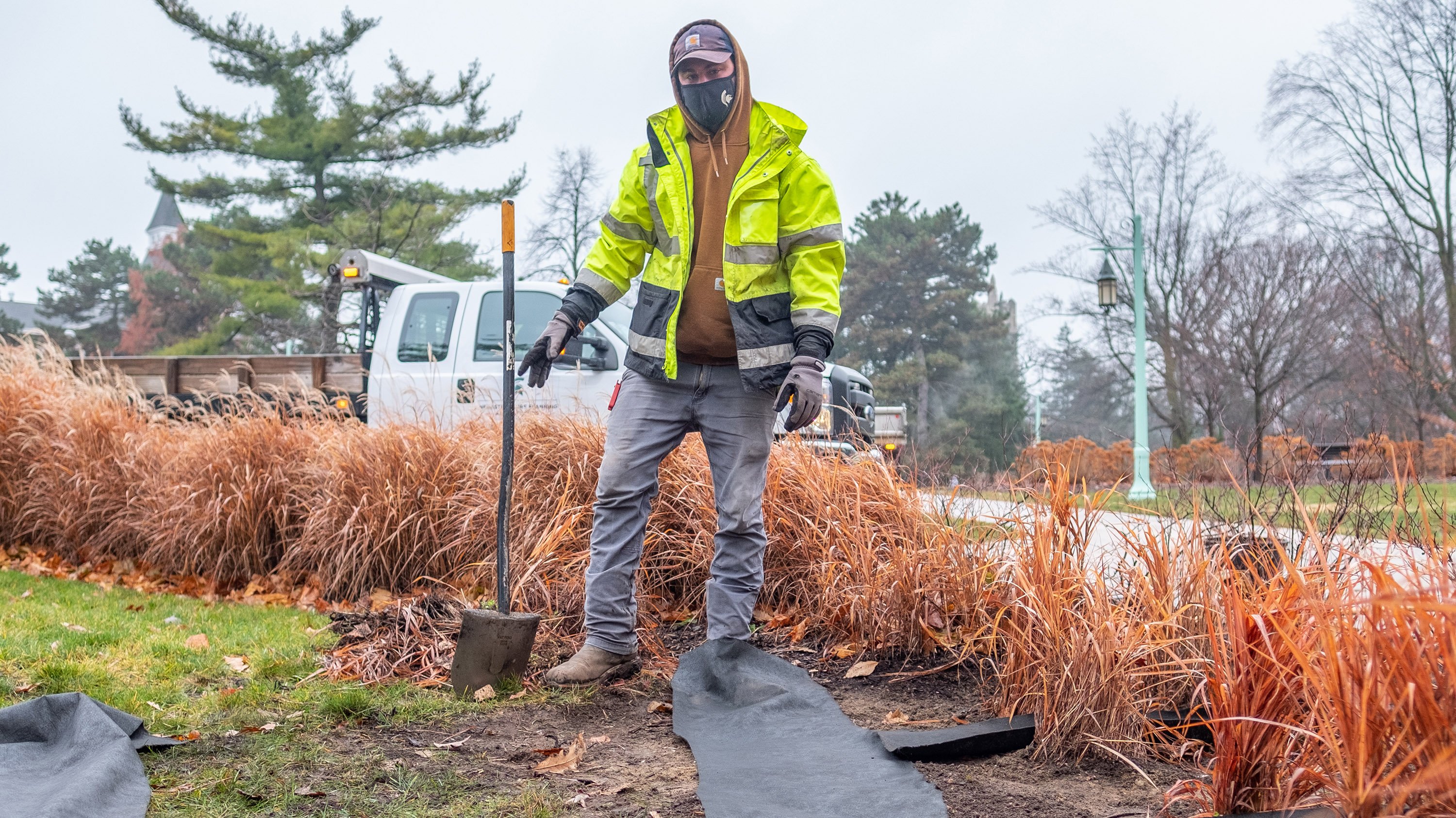 Landscape Services crew holding shovel