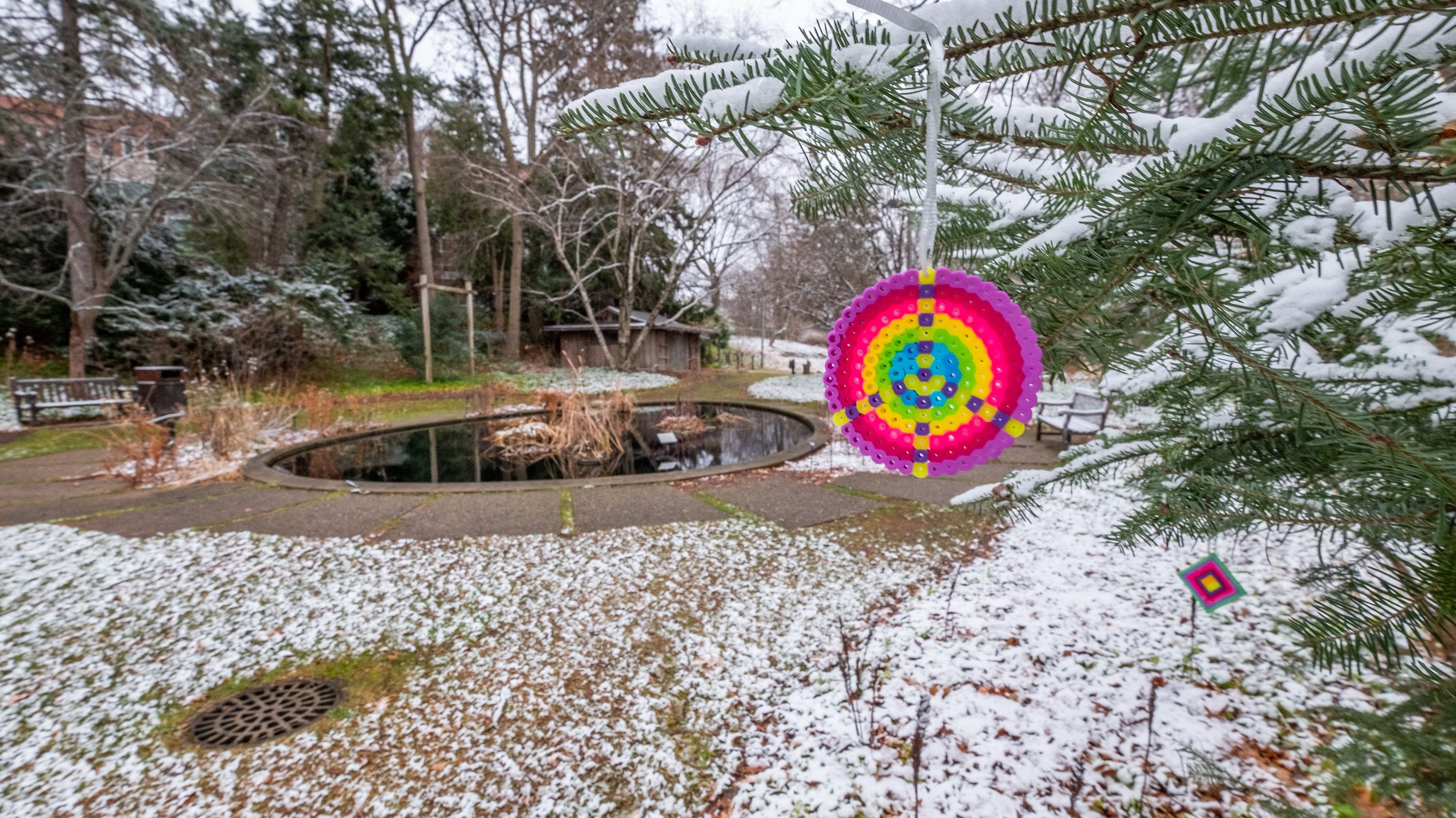 Rainbow peace sign ornament in Beal garden