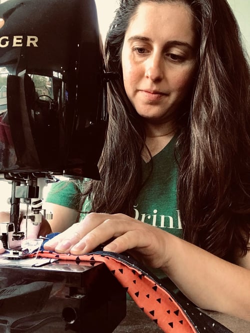 Anna Thelen sewing a mask