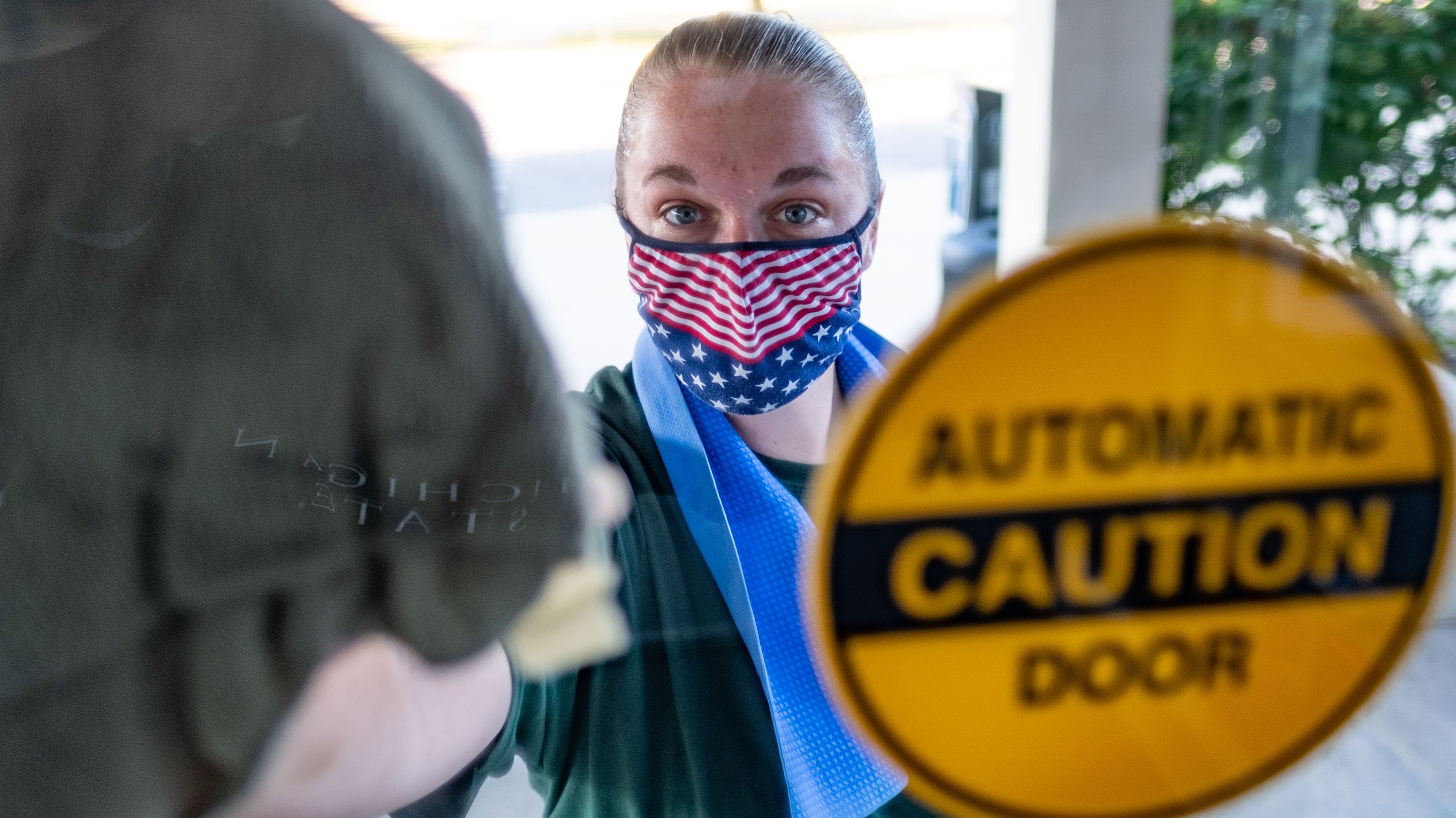 Person sanitizing a window