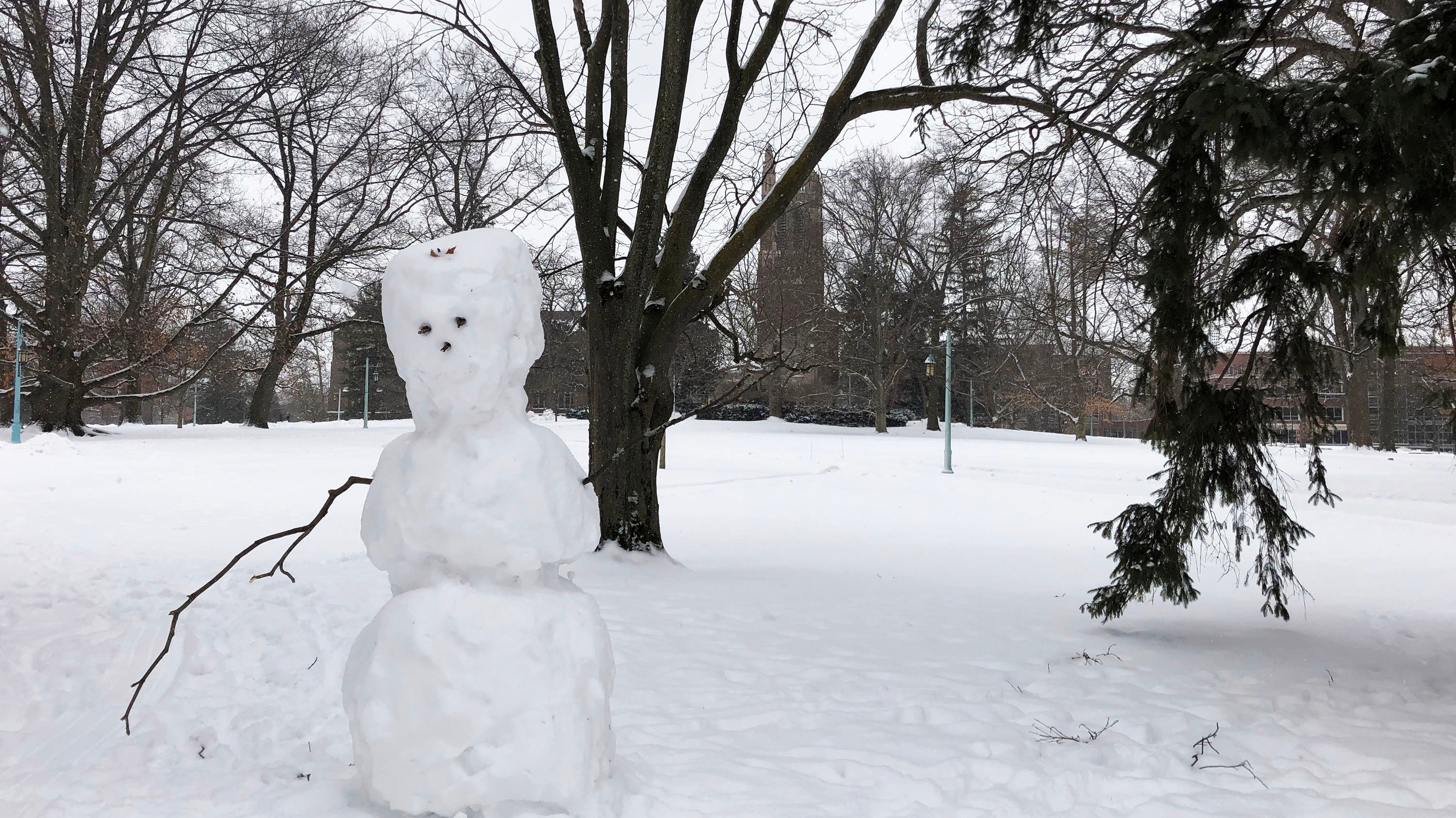 Snowman in front of Beaumont tower