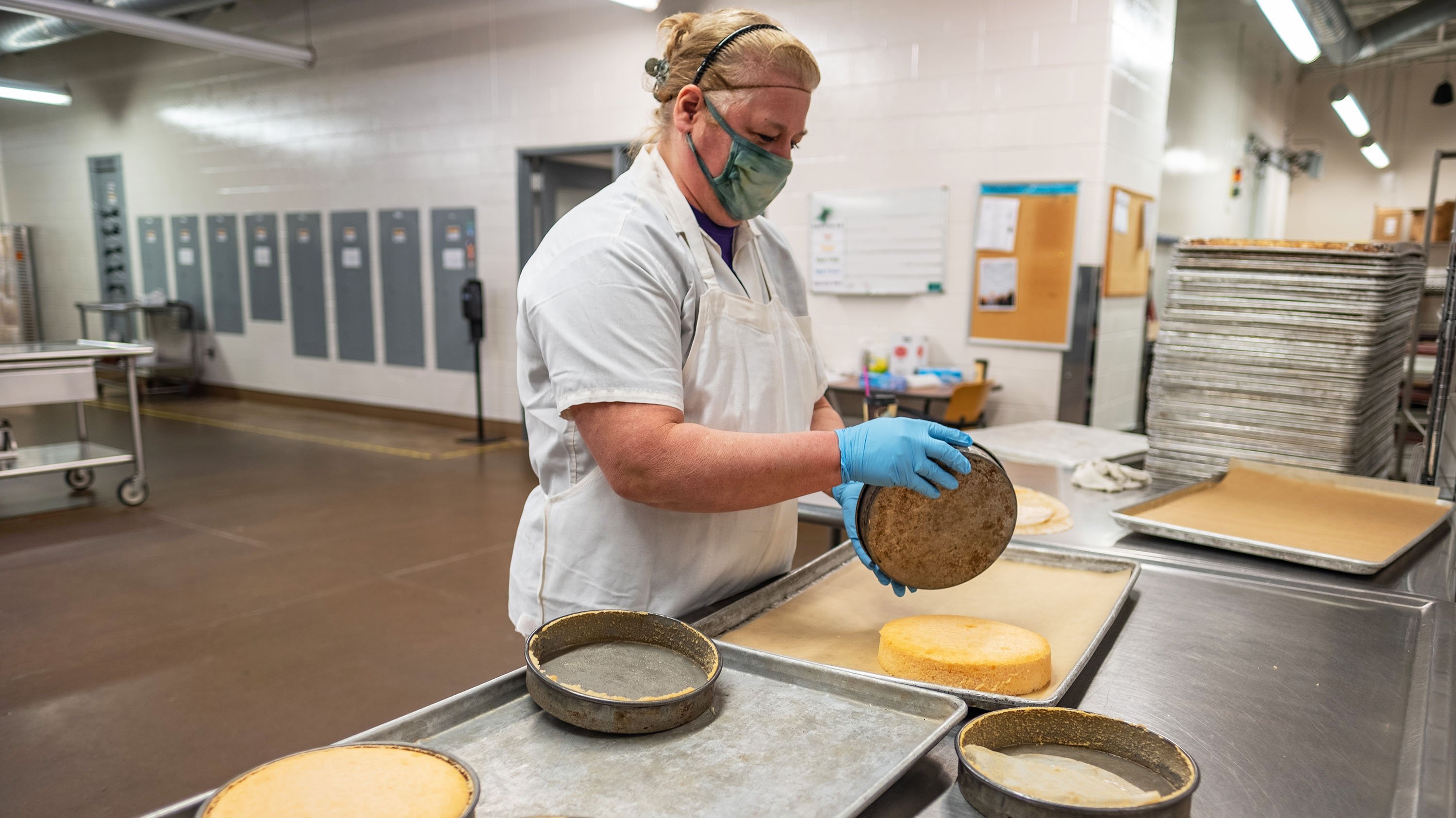 MSU baker de-panning cakes