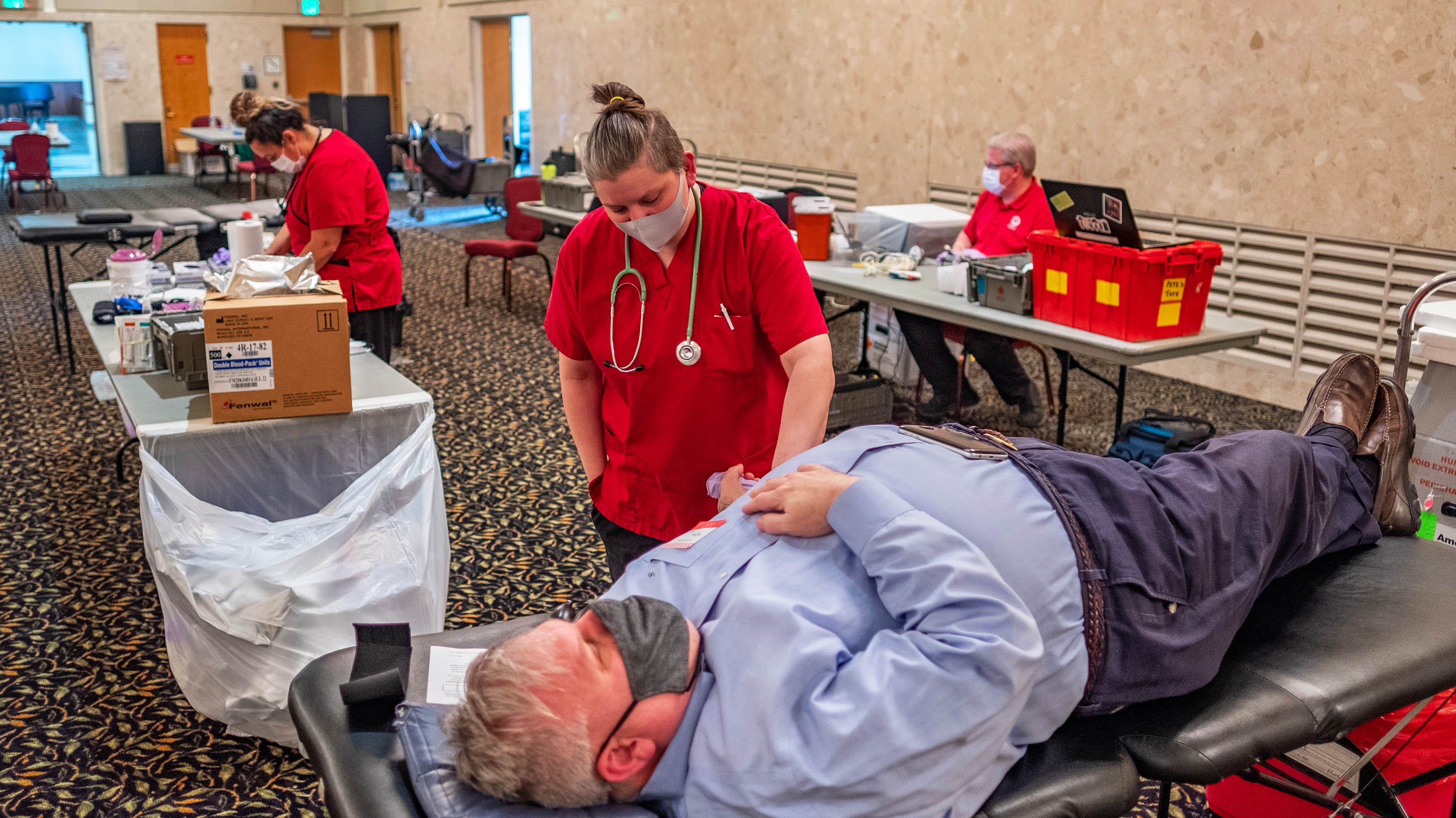 Man participating in blood drive