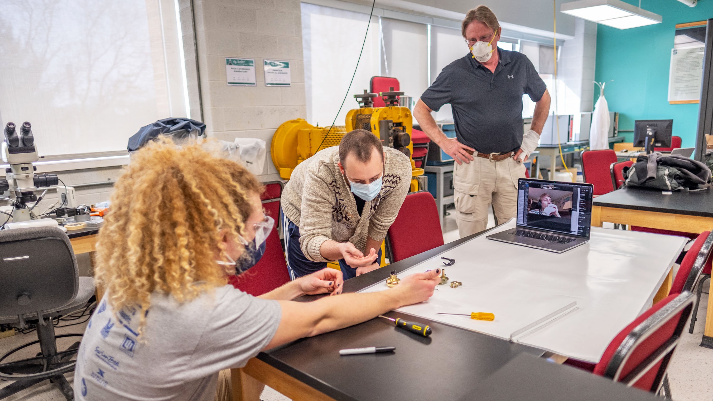 Students examining an object