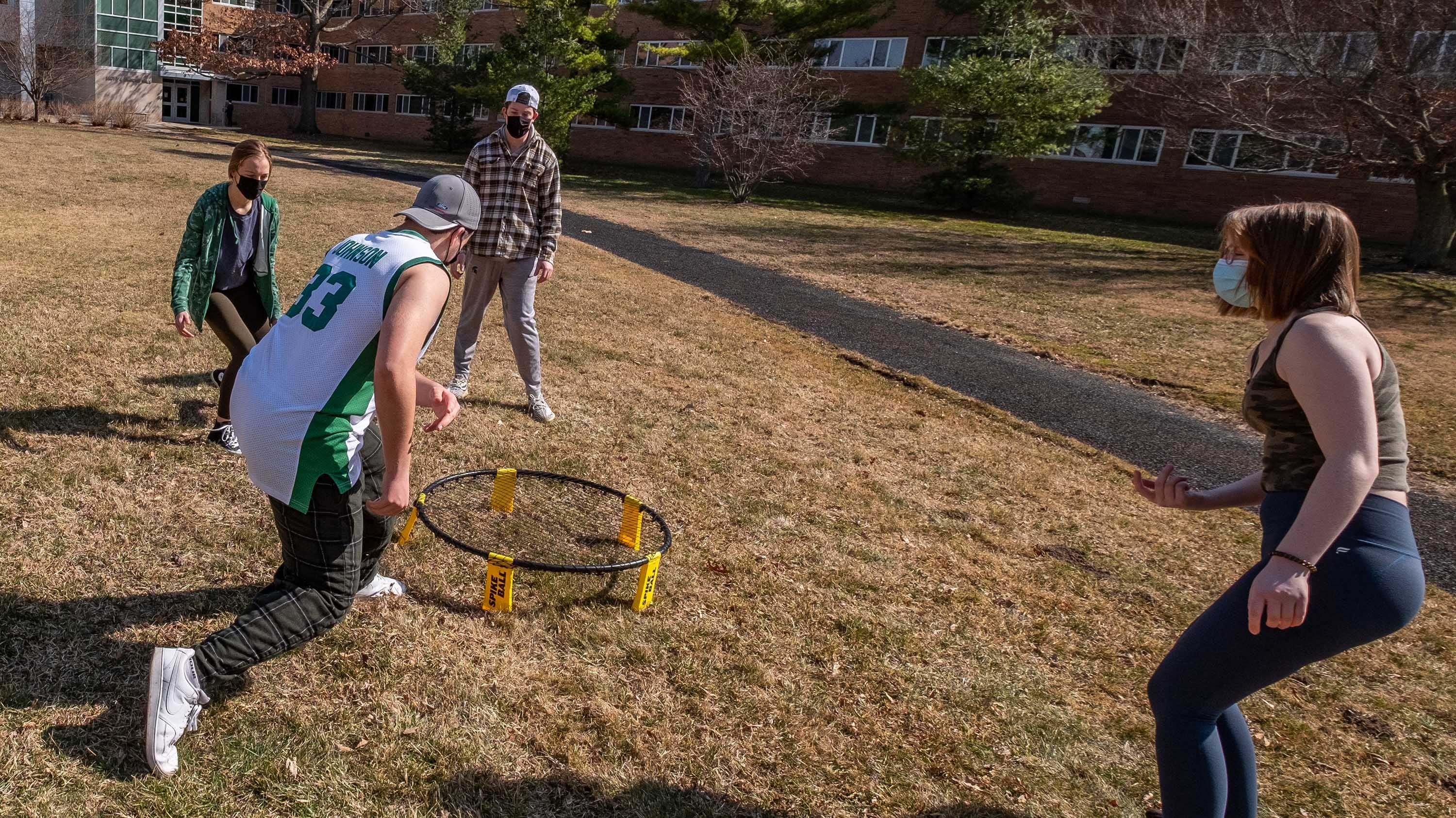 Students playing spike ball