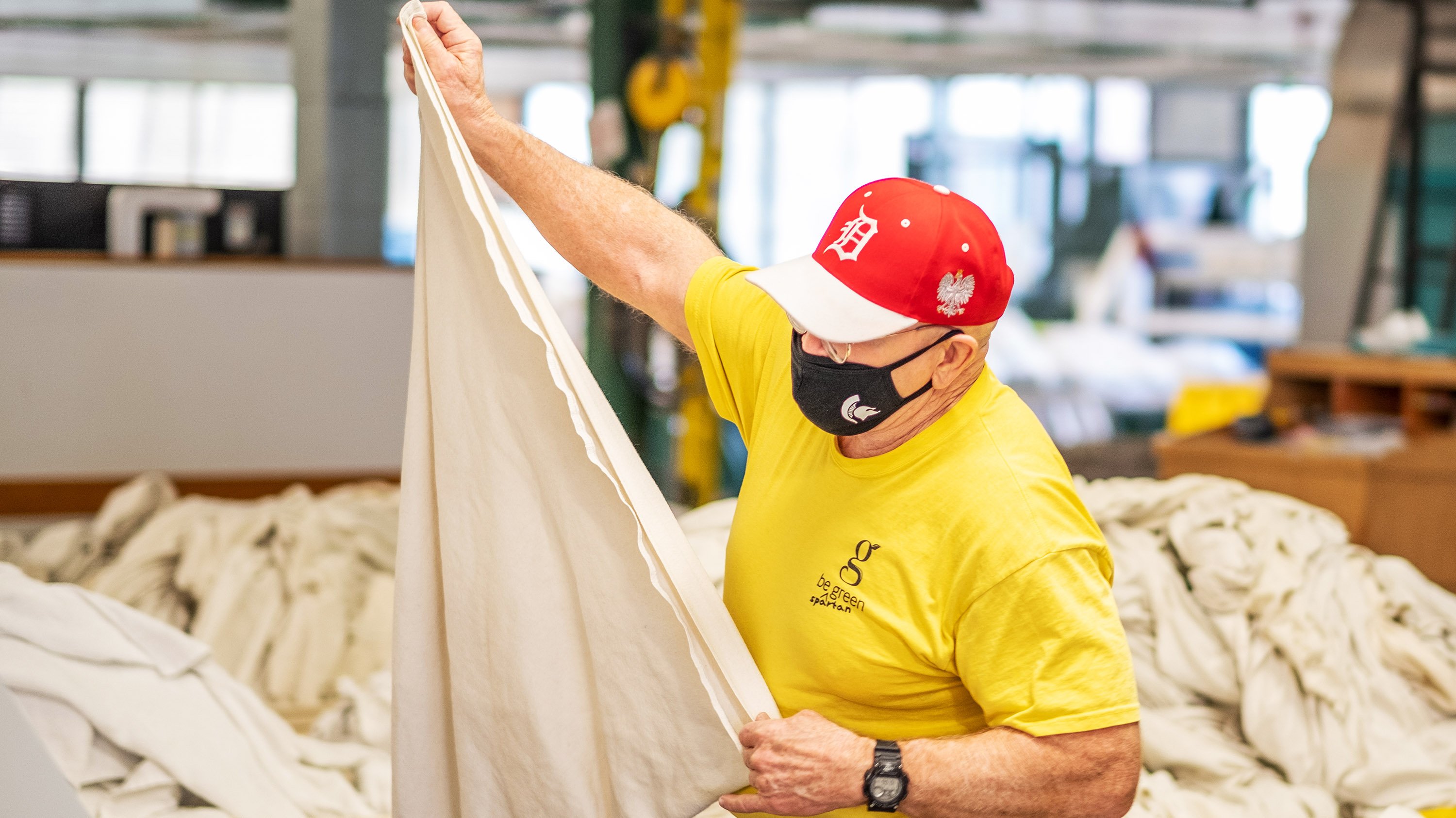 Tom Kostrzewski folding laundry