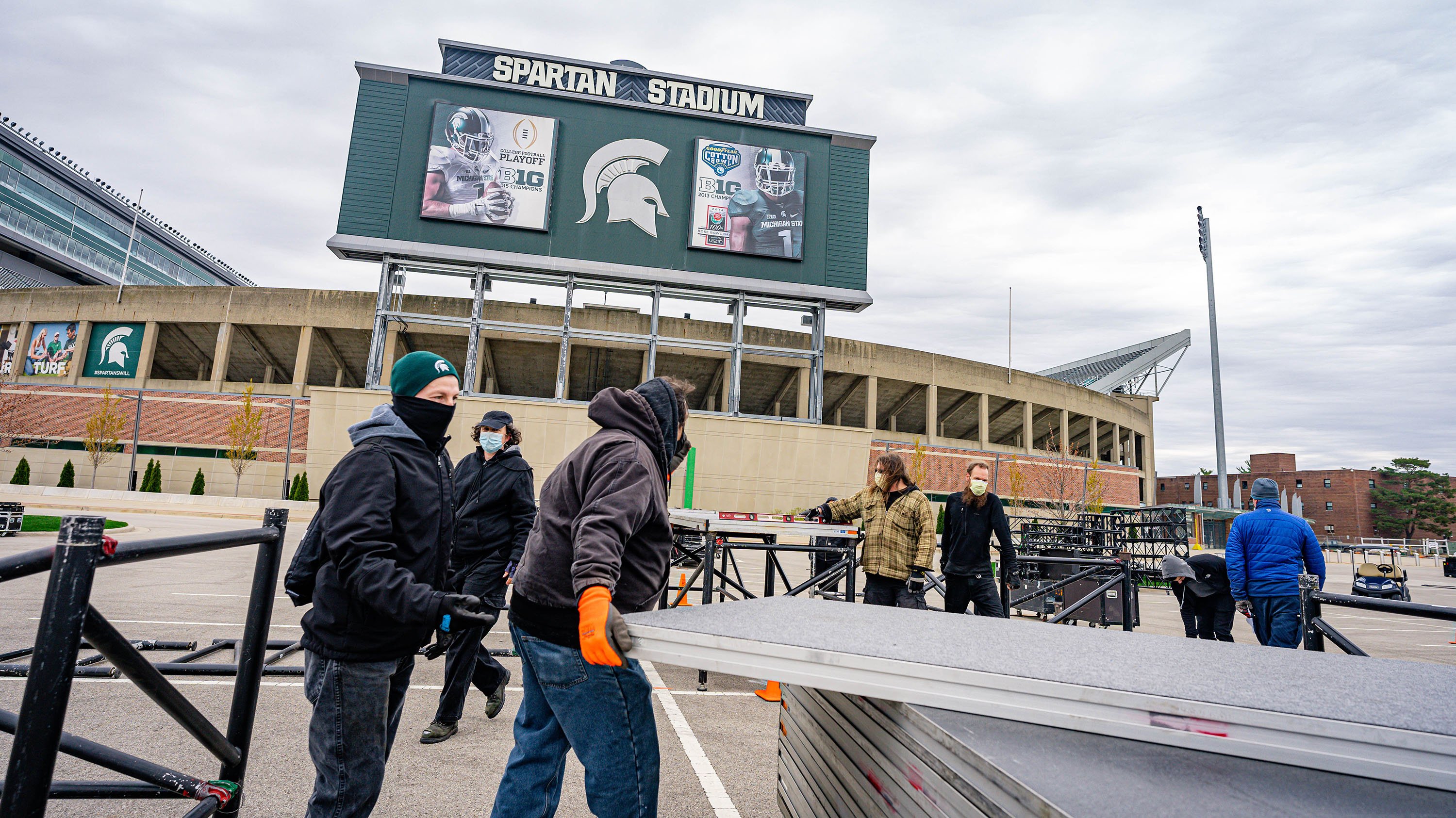 Construction crew building a stage at Spartan Stadium